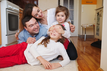 happy family at home on the floor