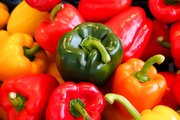 Sweet peppers closeup, textured background