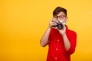 Excited kid with photo camera