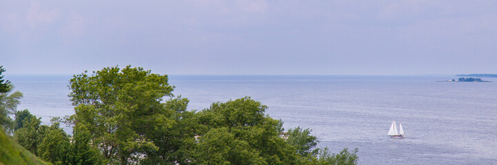 Fototapeta na wymiar Beautiful summer landscape with sailing in the sea. Blue sky