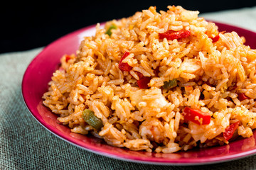 Homemade Chinese fried rice with vegetables and fried eggs