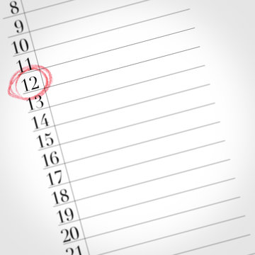 calendar shows the 12th day of the month, detail of one day marked with a red circle
