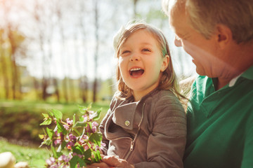 Girl having fun with grandpa
