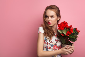 Pretty woman with flower pot