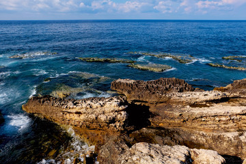 rocky coastline panorama with view over the sea to the horizon