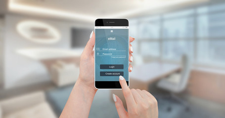 Woman use email app on modern black phone at office