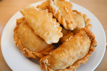 tasty empanadas on white plate ready to be eaten