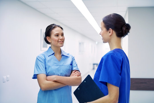 medics, nurses or doctors talking at hospital