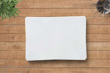 
blank paper with different items on a wooden board - business / concept / ideas 
