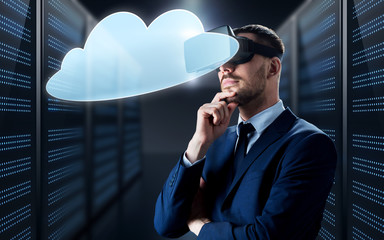 businessman in virtual reality headset with cloud