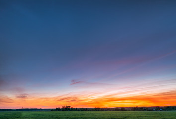 Green Wheat In Spring Field Under Scenic Summer Colorful Sky At 