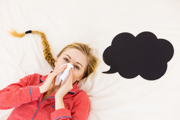 Woman being sick having flu lying on bed