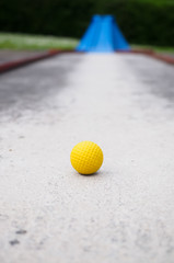 Isolated yellow golf ball