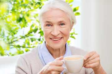 happy senior woman with cup of coffee
