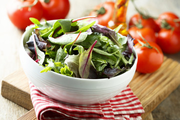 Mixed salad in a white bowl