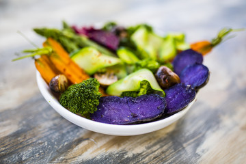 Delicious and healthy salad with colorful vegetables. Rainbow food. 