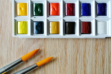 watercolors and brushes