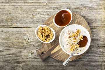 Sweet milk porridge quinoa with honey and walnuts. Top view
