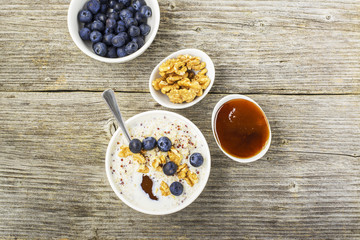 Sweet milk porridge quinoa with honey and walnuts. Top view