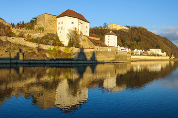 Fototapeta na wymiar Veste Oberhaus is a fortress on hillside along the walkway overlooking the Danube River in Passau, Germany