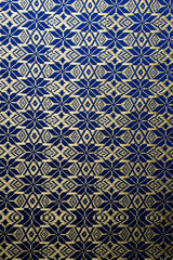Blue and gold traditional Thai fabric texture background - cultural design tablecloth pattern