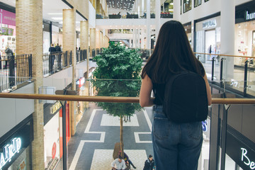 Fototapeta na wymiar young woman stands near store