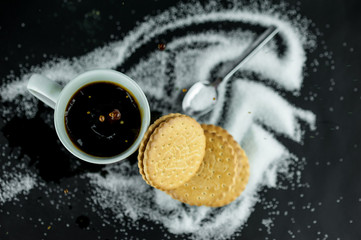 Cup of coffee with biscuits and the word 