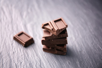 Broken chocolate pieces on table
