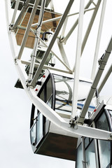 Ferris wheel, cockpit. Carousel in the park.

