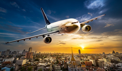 Fototapeta premium Airplane over city