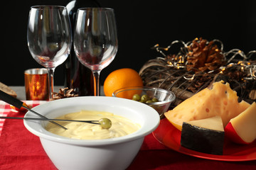 Delicious cheese fondue on table