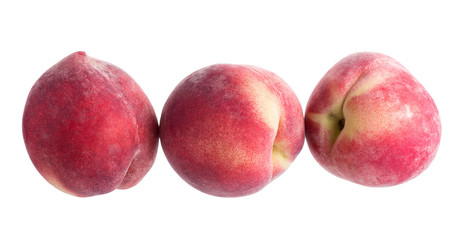 Ripe fresh peaches isolated on white background