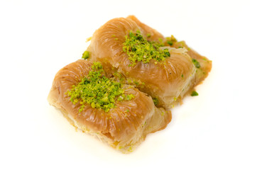 Baklava with pistachio on a white background