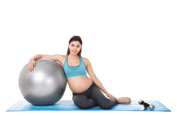 Young beautiful pregnant woman doing yoga exercise isolated on white