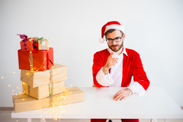 Handsome Santa Claus giving presents