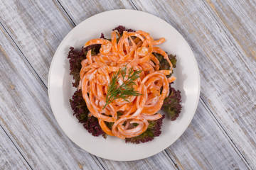 Salad with fresh carrots with sour cream and dill