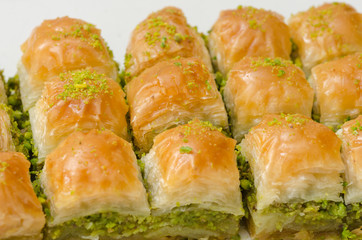 Baklava with pistachio on a white background