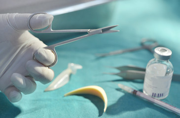 Surgical instruments, silicone nasal implant and silicone chin implants in operating room.