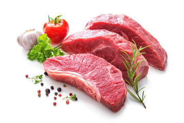 Pieces of raw roast beef meat with ingredients