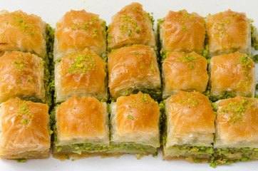 Baklava with pistachio on a white background