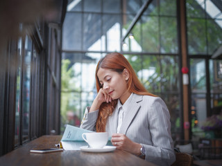 Asian business woman in coffee shop cafe