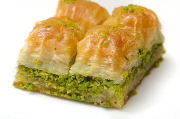 Baklava with pistachio on a white background