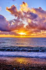 Naklejka na ściany i meble sunset over ocean. Sunset on the beach with beautiful sky. Dramatic sunset