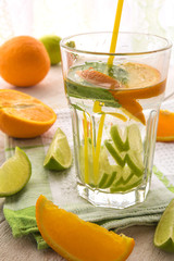 Fresh juicy drink with citrus orange and lime fruit concept of health of the sport and diet