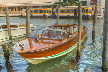Fototapeta na wymiar Wooden boat at the pier. Venice. (Italy)