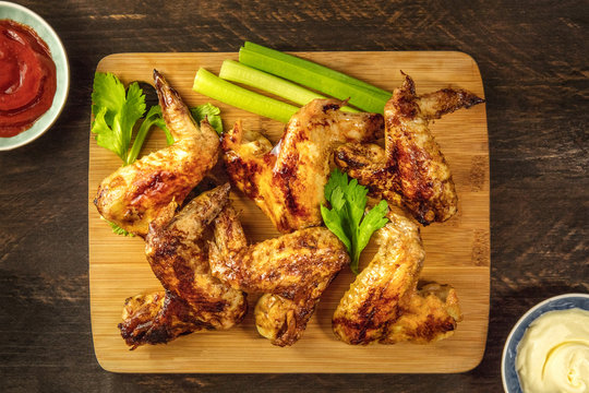 Chicken wings with celery sticks, tomato sauce, and Mayonnaise