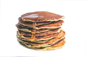 homemade pancakes with maple syrup, closeup toned photo