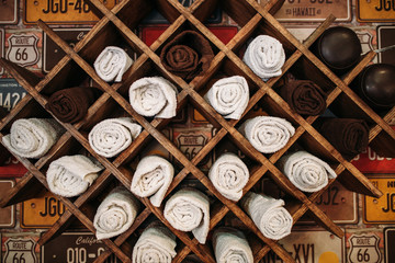 Wooden shelf with many compartments for towels