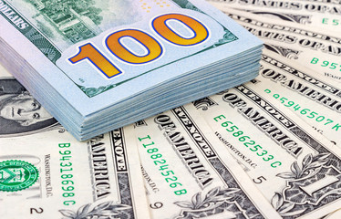Heap of one hundred banknotes of american dollars close up