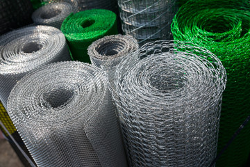 Barbed wire and mesh netting rolls